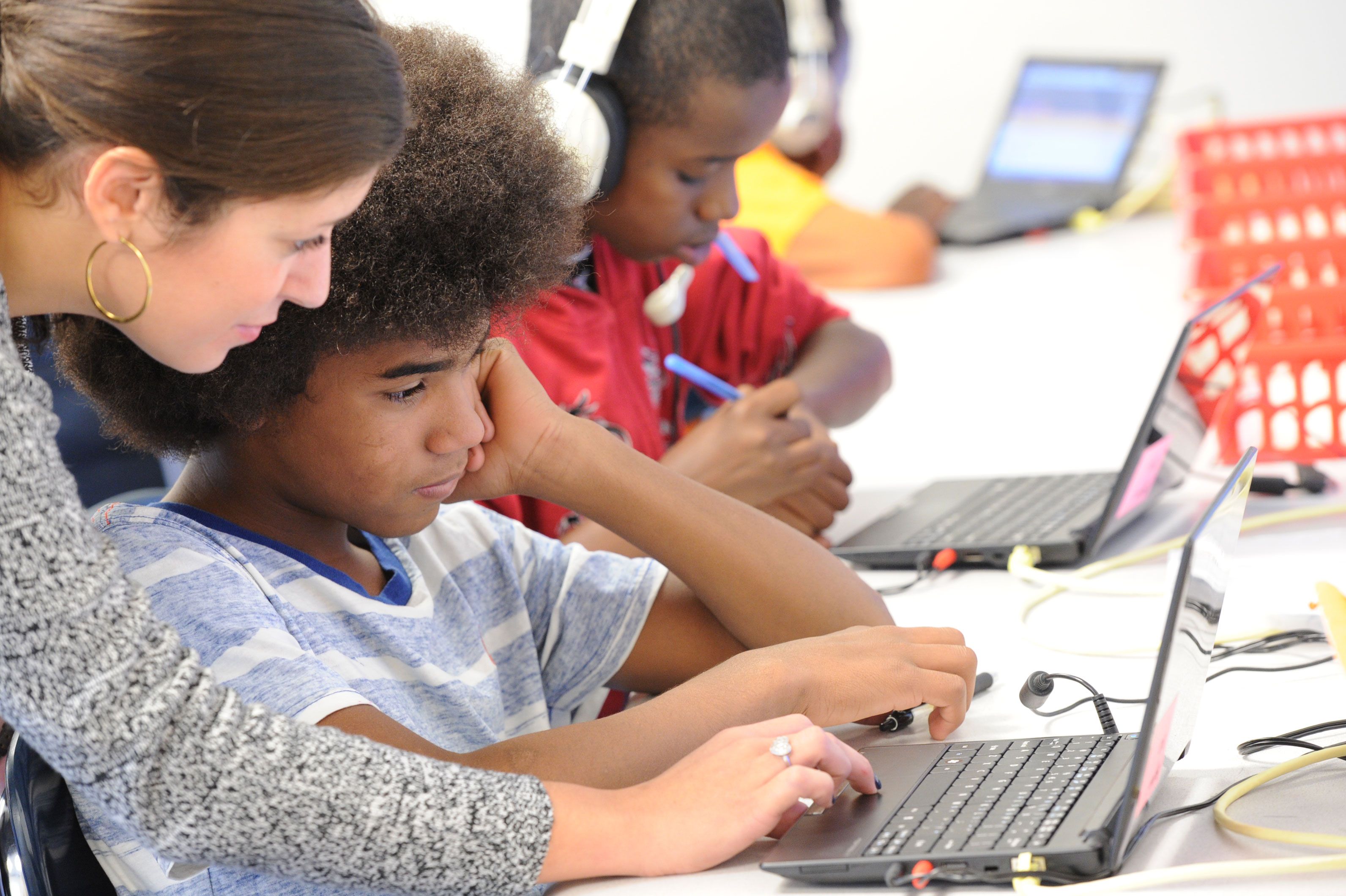teacher and student at computer