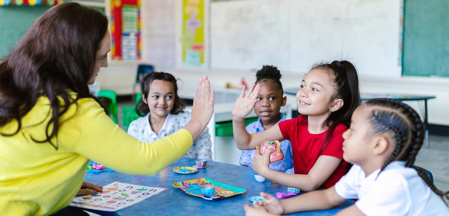 teacher hi-fives student