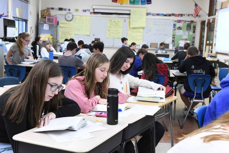 Students from Weber Middle School, Port Washington Union Free School District in Long Island work in small groups.