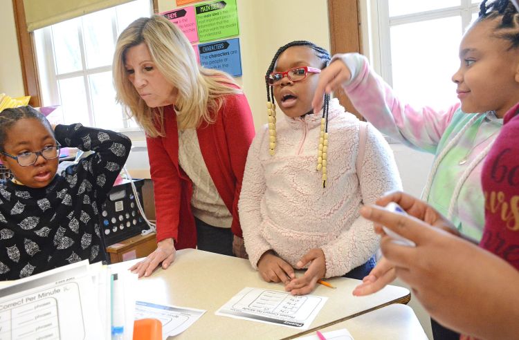 Karen Lee Arthmann, Youth Assistant (School Security) at Rush-Henrietta and NYSUT Board member, works with her students one-on-one and in groups. 